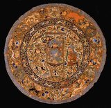 Circular piece of silk with Mongol images, Ilkhanid, early 14th century. Silk, cotton and gold.<br/><br/>

The Ilkhanate, also spelled Il-khanate or Il Khanate was a Mongol khanate established in Persia in the 13th century, considered a part of the Mongol Empire. The Ilkhanate was based, originally, on Genghis Khan's campaigns in the Khwarezmid Empire in 1219–1224, and founded by Genghis's grandson, Hulagu, in territories which today comprise most of Iran, Iraq, Afghanistan, Turkmenistan, Armenia, Azerbaijan, Georgia, Turkey, and some regions of western Pakistan. The Ilkhanate initially embraced many religions, but was initially sympathetic to Buddhism and Nestorian Christianity. Later Ilkhanate rulers, beginning with Ghazan in 1295, embraced Islam.
