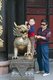 China: A child plays on a bronze mythical animal, Wenshu Yuan (Wenshu Temple), Chengdu, Sichuan Province